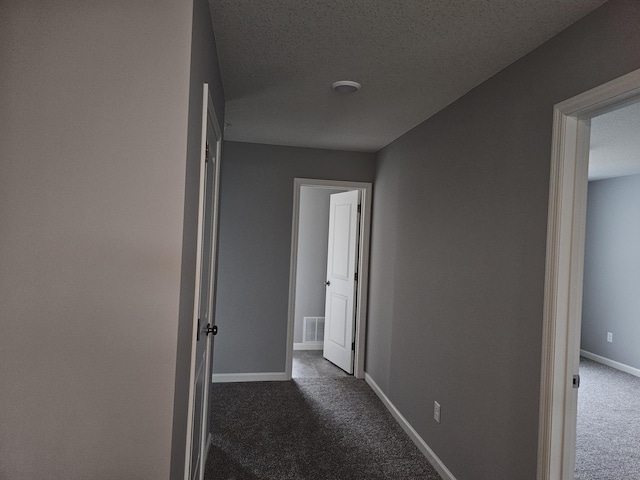 17121 61st St NE, Otsego, MN 55330 - hall with dark colored carpet and a textured ceiling