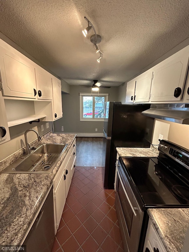 4371 Wilshire Blvd Unit 202, Mound, MN 55364 - kitchen with appliances with stainless steel finishes, under cabinet range hood, white cabinets, dark tile patterned floors, and track lighting