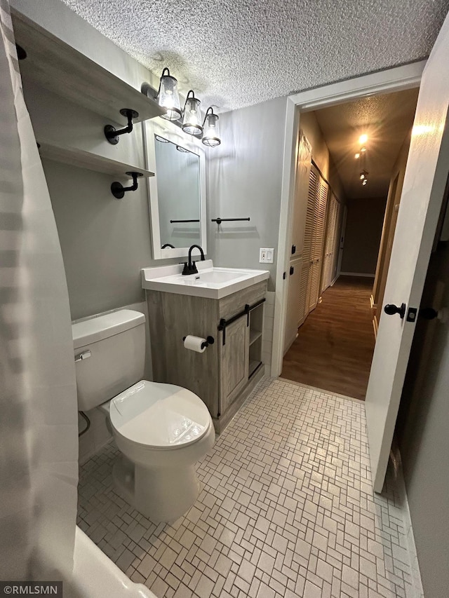 4371 Wilshire Blvd Unit 202, Mound, MN 55364 - bathroom featuring vanity and a textured ceiling