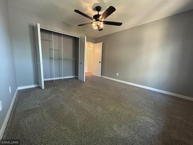 4371 Wilshire Blvd Unit 202, Mound, MN 55364 - unfurnished bedroom with dark colored carpet, a closet, a ceiling fan, and a textured ceiling