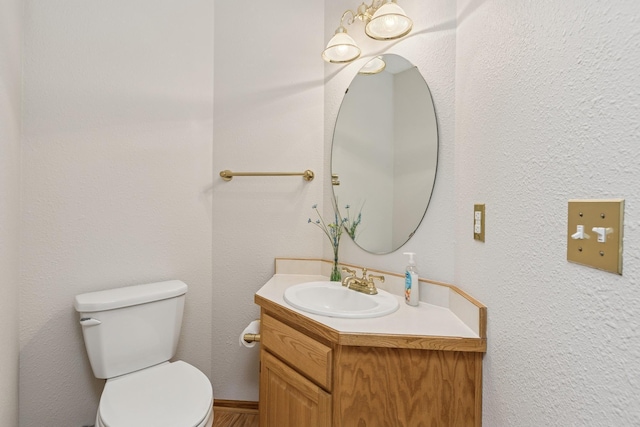 3662 Pond View Pt, Eagan, MN 55122 - half bathroom with toilet, vanity, and wood finished floors
