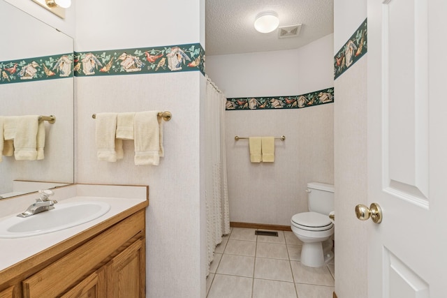 3662 Pond View Pt, Eagan, MN 55122 - full bathroom featuring toilet, tile patterned flooring, a textured ceiling, and vanity