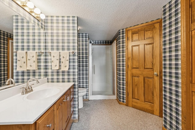 3662 Pond View Pt, Eagan, MN 55122 - full bathroom with a textured ceiling, wallpapered walls, a stall shower, toilet, and vanity