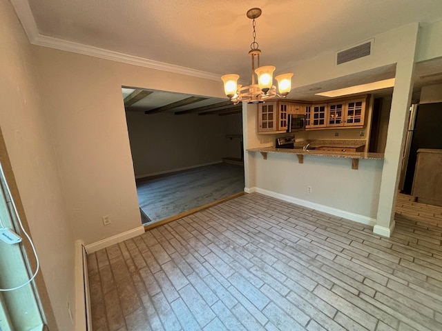 6075 Lincoln Dr Unit 201, Edina, MN 55436 - kitchen with stainless steel microwave, a chandelier, crown molding, a kitchen breakfast bar, and glass insert cabinets