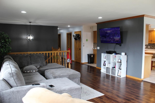 living area with baseboards, recessed lighting, and wood finished floors