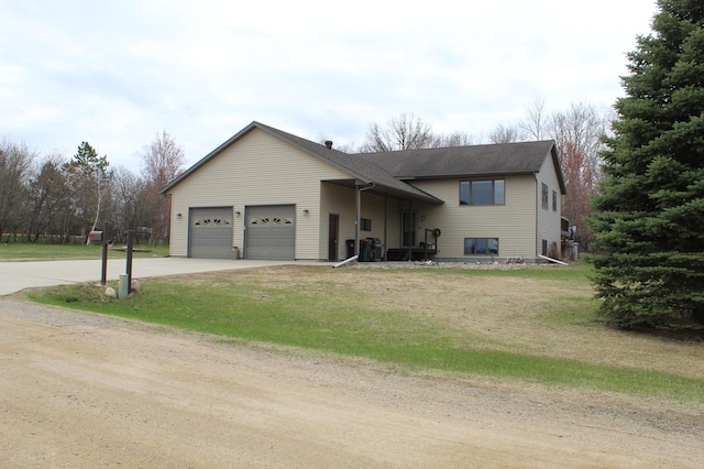 602 Nelson St W, Eagle Bend, MN 56446 - split level home featuring driveway, an attached garage, a front lawn, and roof with shingles