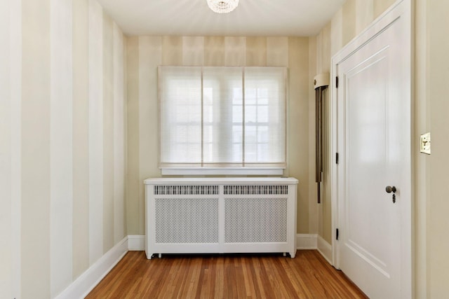 4606 Drexel Ave, Edina, MN 55424 - spare room with radiator heating unit, wood finished floors, and baseboards