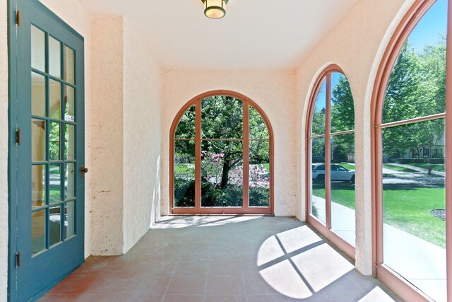 4606 Drexel Ave, Edina, MN 55424 - doorway with a textured wall, healthy amount of natural light, and tile patterned floors