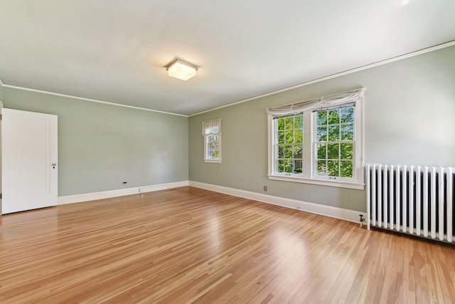 4606 Drexel Ave, Edina, MN 55424 - spare room featuring radiator, ornamental molding, light wood finished floors, and baseboards