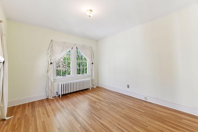 4606 Drexel Ave, Edina, MN 55424 - unfurnished room with radiator, light wood finished floors, baseboards, and ornamental molding