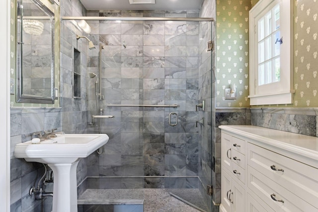 4606 Drexel Ave, Edina, MN 55424 - bathroom with tile walls, a shower stall, wallpapered walls, and a wainscoted wall