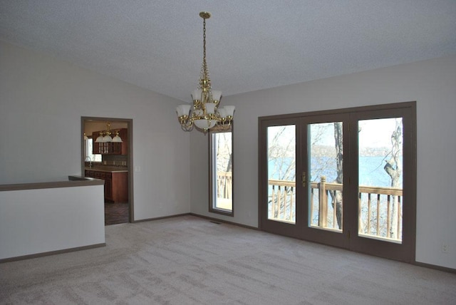 767 Shoreacres Dr, Fairmont, MN 56031 - interior space featuring a notable chandelier, baseboards, light carpet, and a healthy amount of sunlight