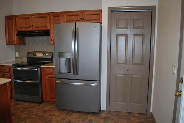 767 Shoreacres Dr, Fairmont, MN 56031 - kitchen featuring light countertops, brown cabinets, stainless steel appliances, and under cabinet range hood