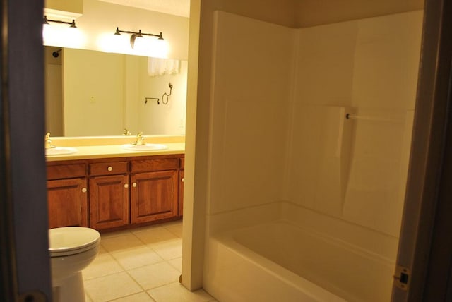 767 Shoreacres Dr, Fairmont, MN 56031 - bathroom featuring a sink, double vanity, toilet, shower / bathing tub combination, and tile patterned flooring