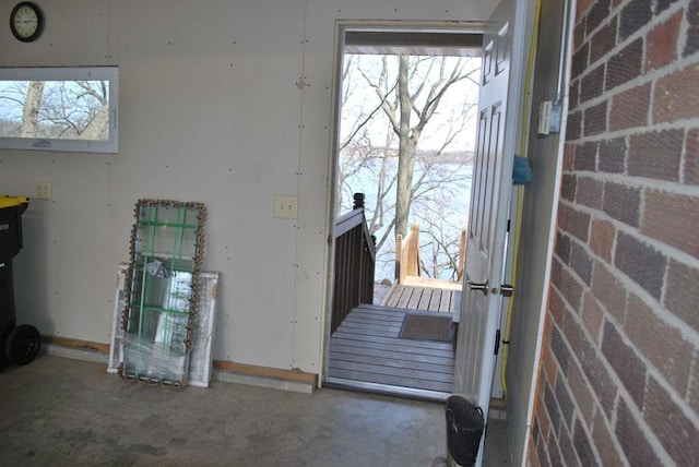 767 Shoreacres Dr, Fairmont, MN 56031 - doorway with baseboards and a wealth of natural light