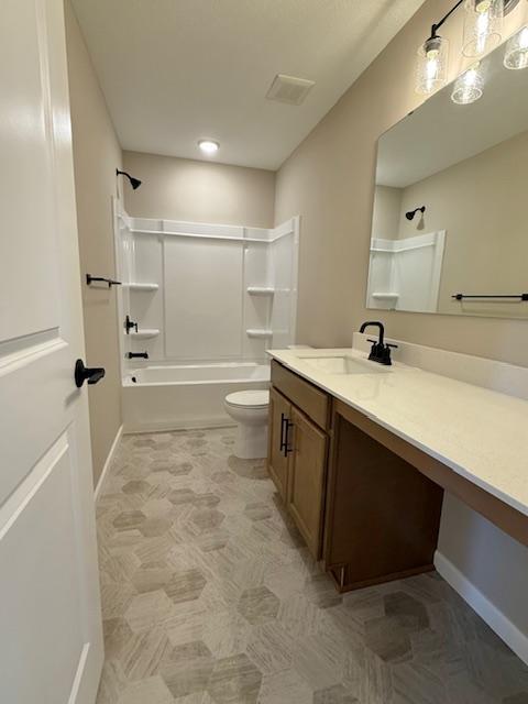 full bathroom with toilet, shower / washtub combination, vanity, baseboards, and visible vents
