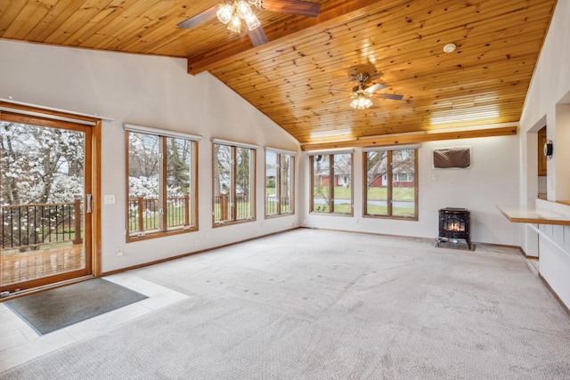 unfurnished living room with wood ceiling, ceiling fan, a wood stove, and vaulted ceiling with beams