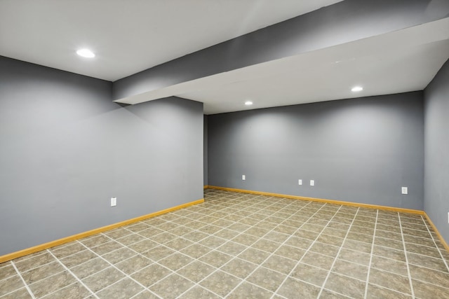 finished basement featuring recessed lighting and baseboards