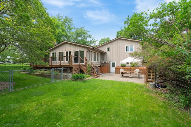 3293 Rice Creek Ter, New Brighton, MN 55112 - back of property featuring a sunroom, a patio area, stairway, and a deck