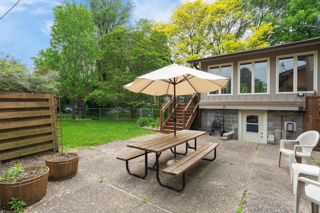 3293 Rice Creek Ter, New Brighton, MN 55112 - view of patio / terrace with outdoor dining area and stairway
