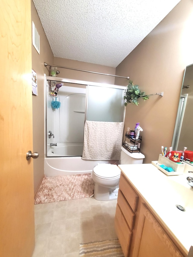 full bathroom with a textured ceiling, combined bath / shower with glass door, visible vents, toilet, and vanity