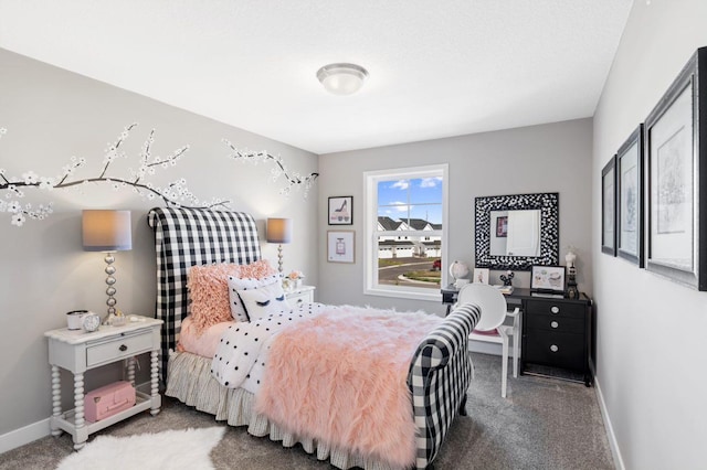 carpeted bedroom featuring baseboards