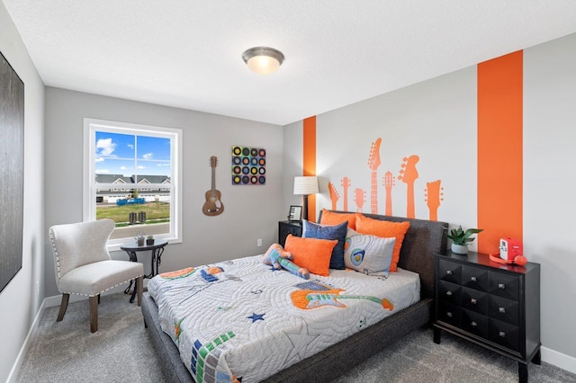 carpeted bedroom featuring baseboards