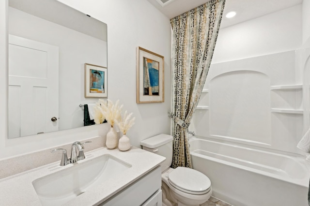 bathroom featuring vanity, shower / bath combination with curtain, and toilet
