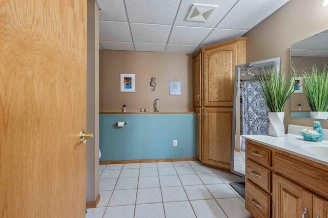 interior space with baseboards, washer hookup, visible vents, and light tile patterned floors