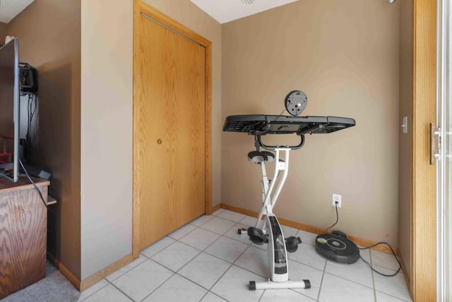workout area with light tile patterned floors