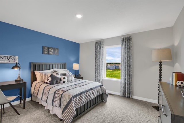 carpeted bedroom with baseboards