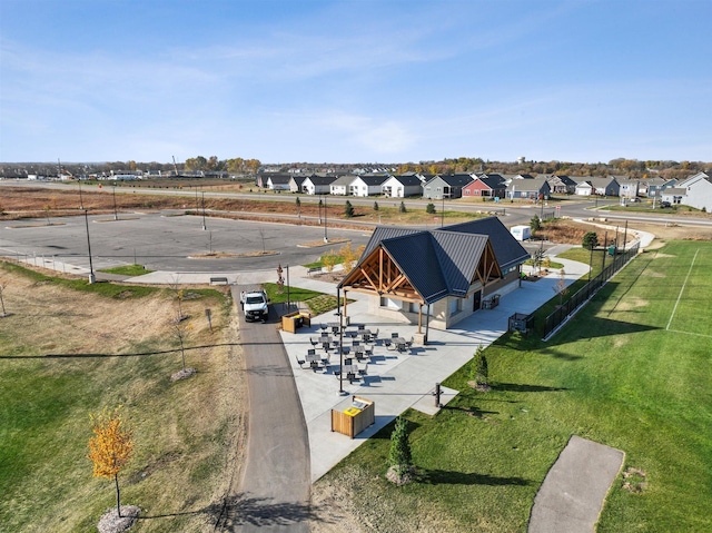 birds eye view of property with a residential view