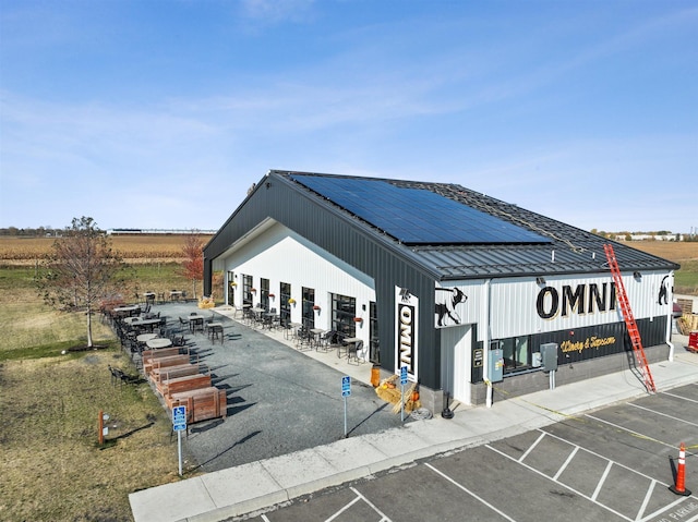 view of building exterior with uncovered parking
