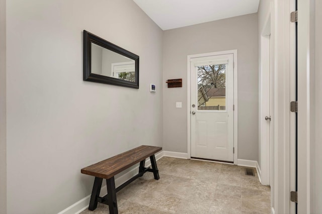 doorway featuring visible vents and baseboards