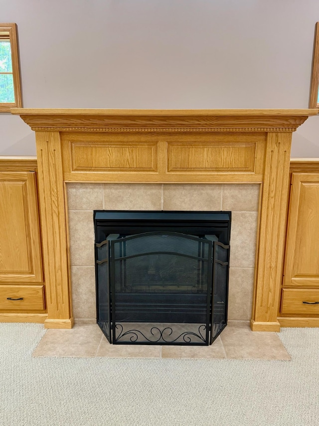 715 Crest Ln, Ellsworth, WI 54011 - detailed view of a tiled fireplace and carpet floors