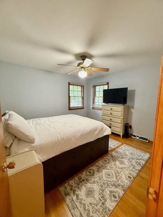 715 Crest Ln, Ellsworth, WI 54011 - bedroom featuring wood finished floors and ceiling fan