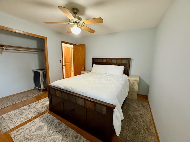 715 Crest Ln, Ellsworth, WI 54011 - bedroom featuring a closet, baseboards, a ceiling fan, and wood finished floors