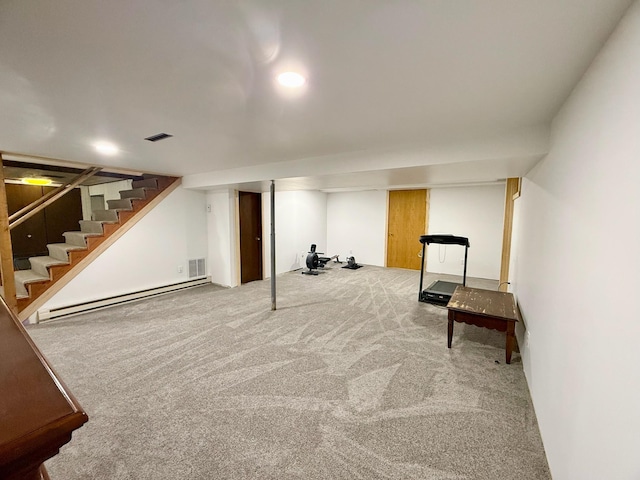715 Crest Ln, Ellsworth, WI 54011 - finished basement featuring baseboard heating, stairs, and carpet flooring
