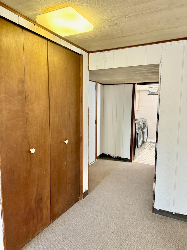 715 Crest Ln, Ellsworth, WI 54011 - hall featuring washer and clothes dryer and carpet floors