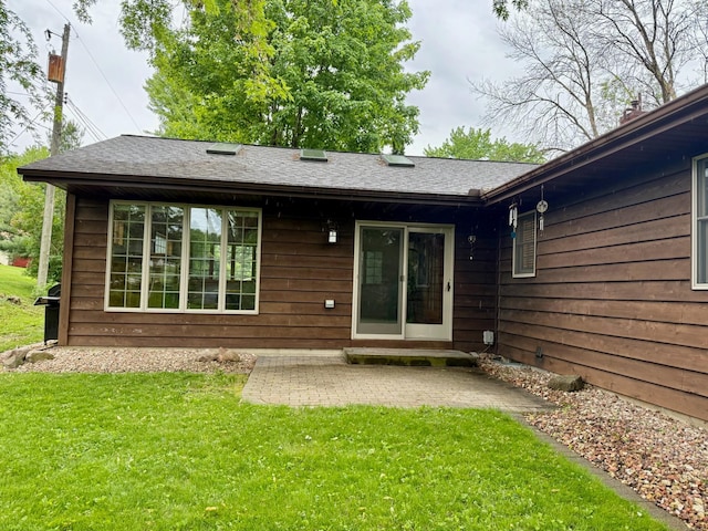 715 Crest Ln, Ellsworth, WI 54011 - back of property featuring a yard and a patio area