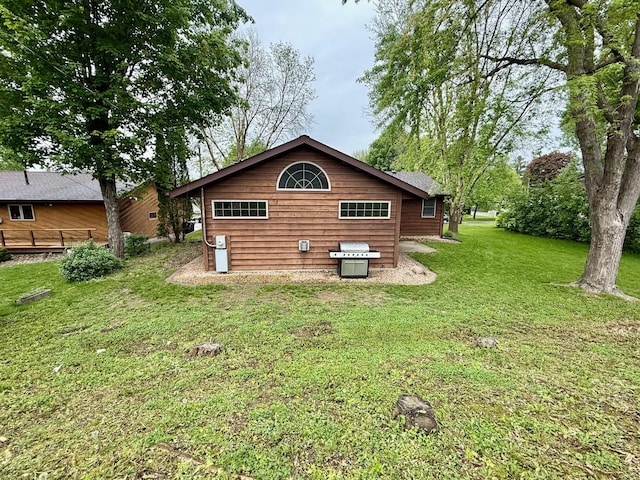715 Crest Ln, Ellsworth, WI 54011 - rear view of house featuring a yard