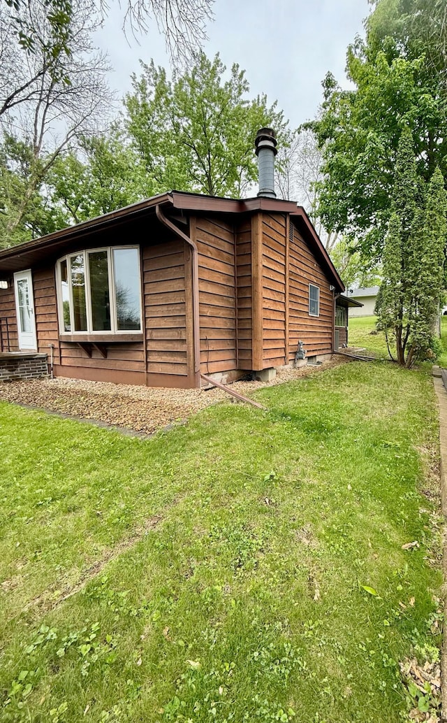 715 Crest Ln, Ellsworth, WI 54011 - view of side of property with a yard and a chimney