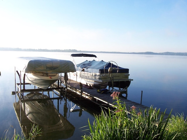 view of dock featuring a water view and boat lift