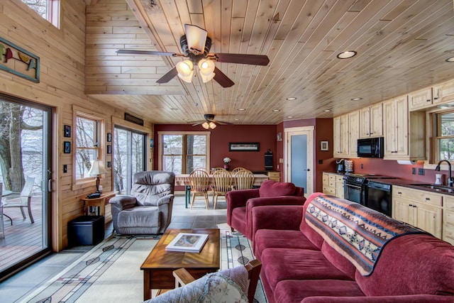 living area featuring wooden ceiling, wood walls, a ceiling fan, and recessed lighting
