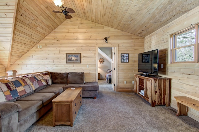 living area with carpet, vaulted ceiling, wooden ceiling, wooden walls, and a ceiling fan
