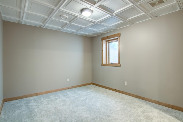 carpeted spare room with baseboards