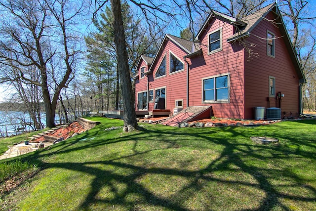 back of property featuring a yard