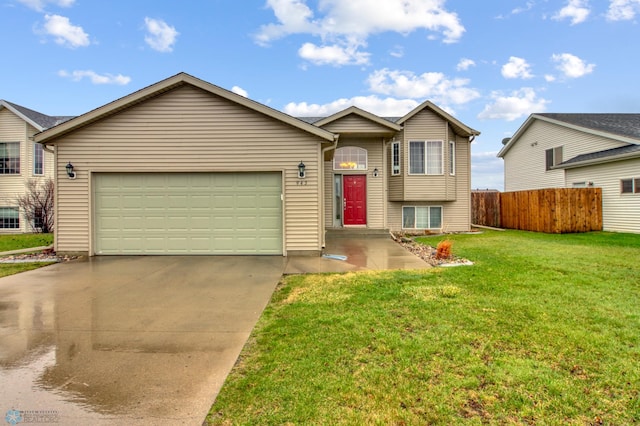 view of front of house with a garage, a front lawn, fence, and driveway