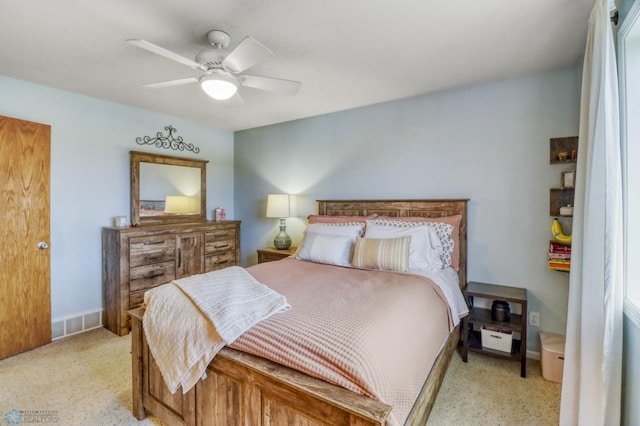 bedroom featuring ceiling fan, light carpet, and visible vents