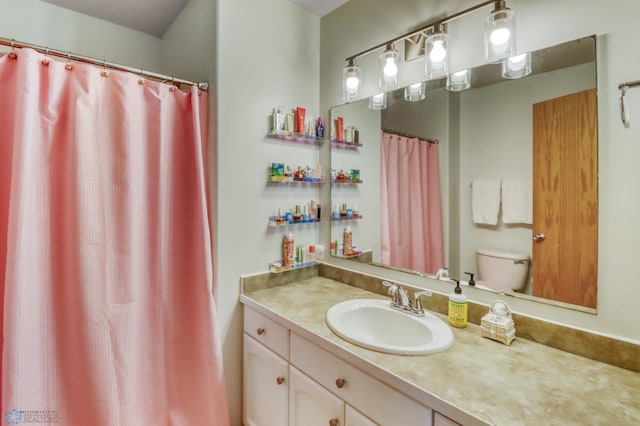 full bath with vanity and toilet